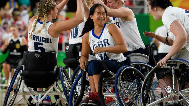 Women wheelchair basketball players celebrate