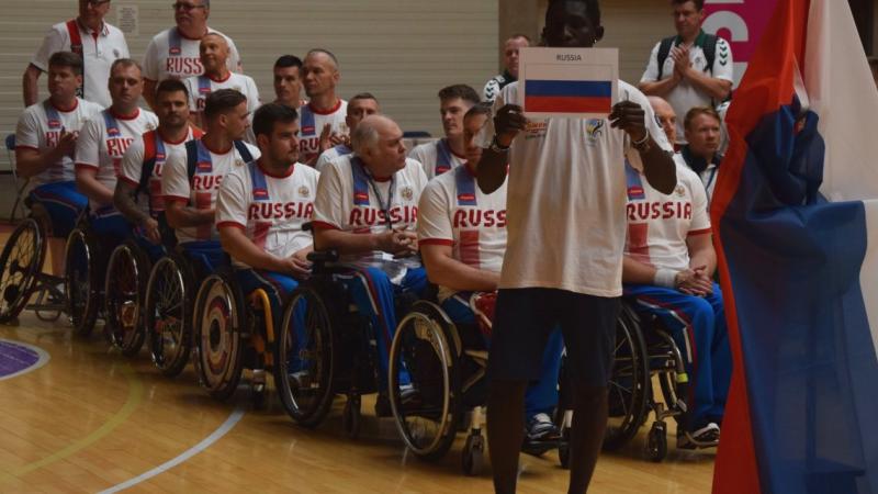 a group of male wheelchair basketball players 