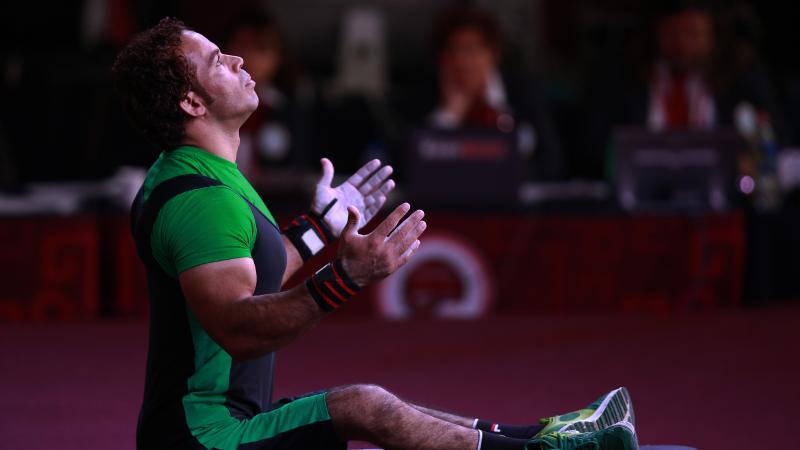 a male powerlifter prepares on the bench