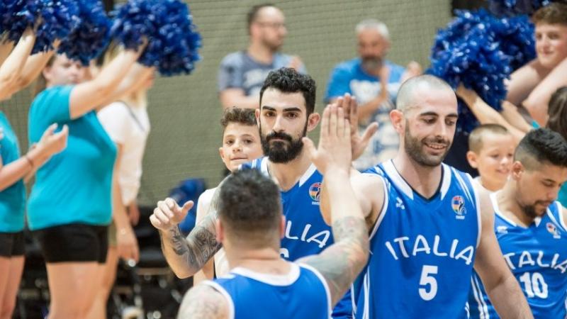 a group of male wheelchair basketballers on court