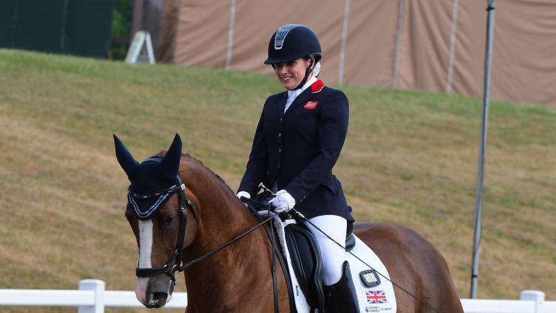 female Para equestrian rider Natasha Baker smiles on her horse