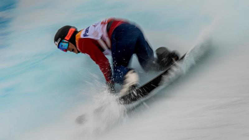 Men on a snowboard in the snow