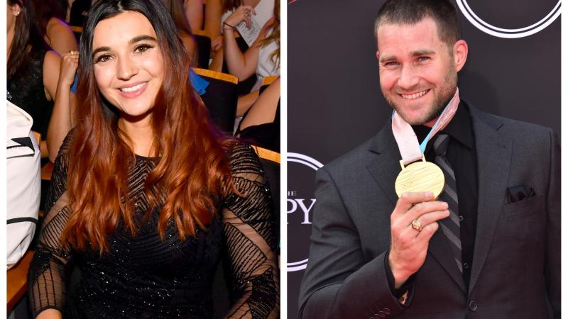 Female Para snowboarder Brenna Huckaby and male Para snowboarder Mike Schultz at an awards ceremony