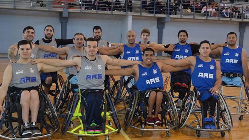 a group of Argentinian male wheelchair basketballers pose on a court