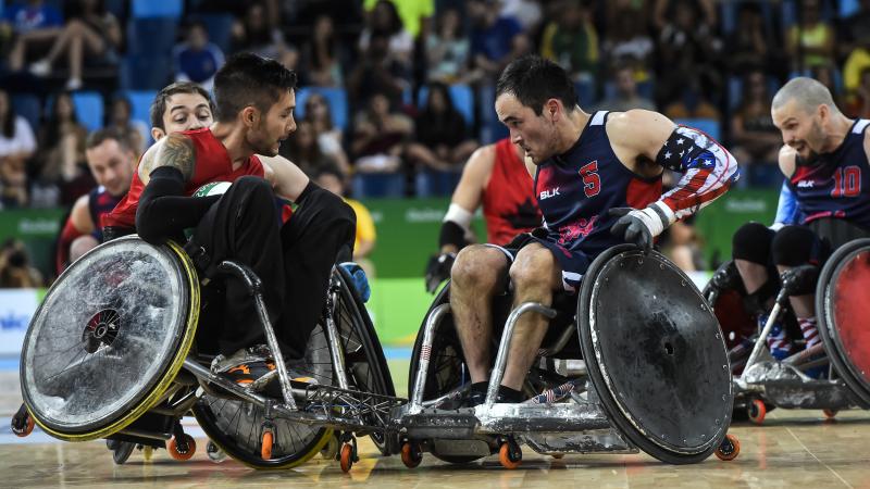 male wheelchair rugby player Trevor Hirschfeild collides on court with a US male player