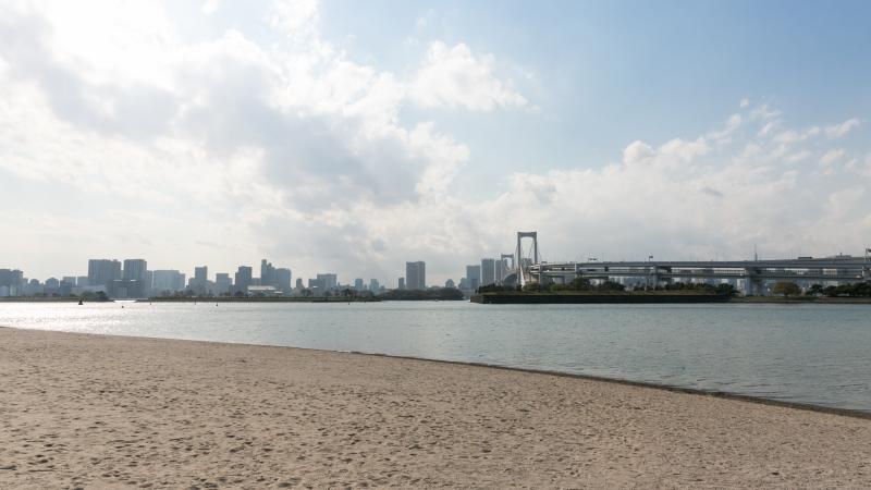 a wide shot of the beach and bay at Odaiba Marine Park in Tokyo