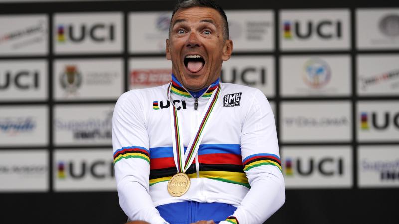 Fabrizio Cornegliani celebrates on the podium with a big smile