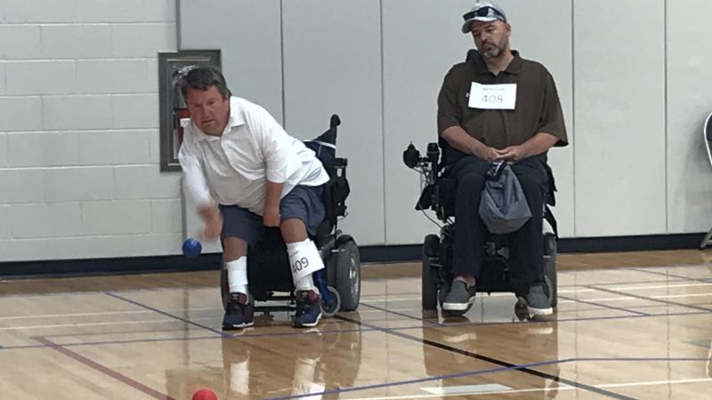 male boccia player Nick Taylor takes a throw