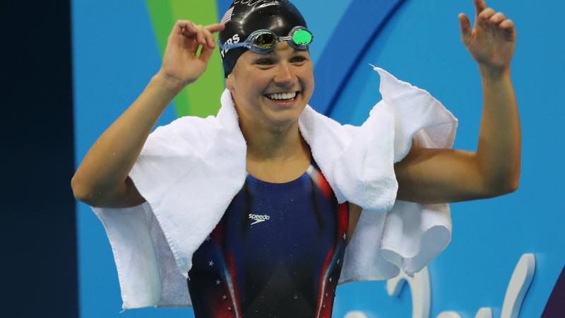 female Para swimmer Rebecca Meyers celebrates after getting out of the pool