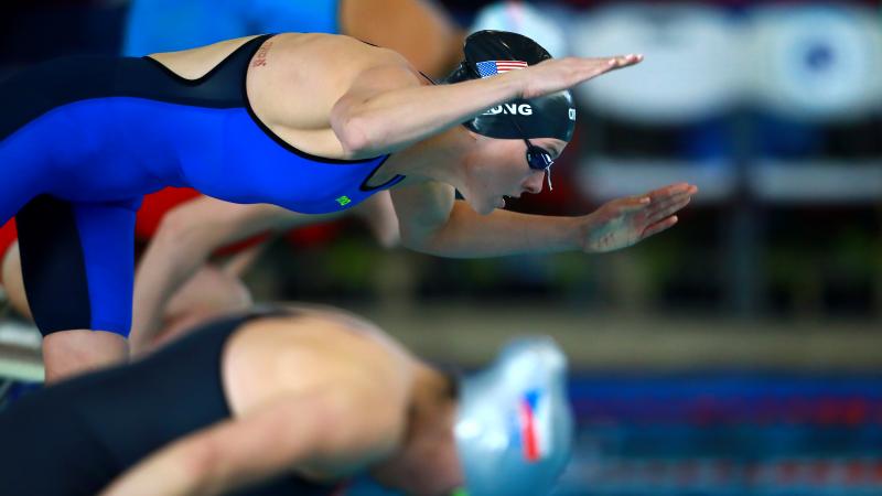 female Para swimmer Jessica Long dives into the swimming pool