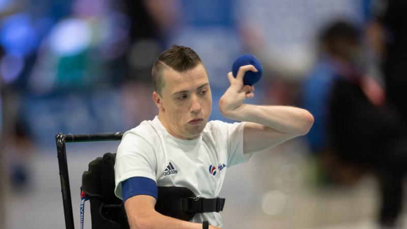 male boccia player David Smith plays a shot