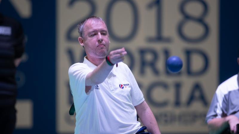 male boccia player Stephen McGuire takes a shot