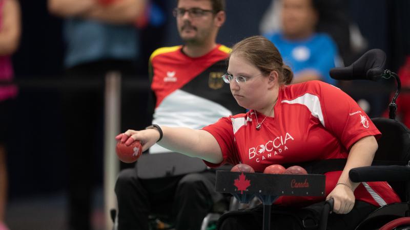 female boccia player Alison Levine takes a shot