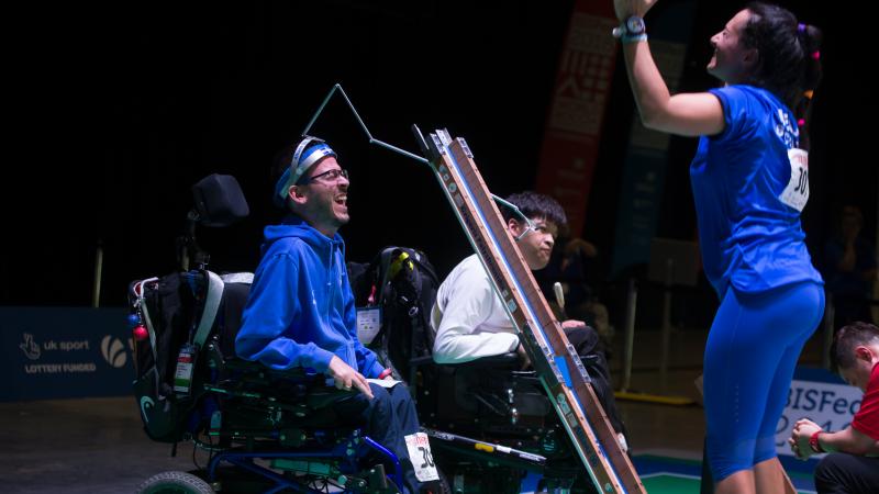 male boccia player Greg Polychronidis celebrates his winning ball