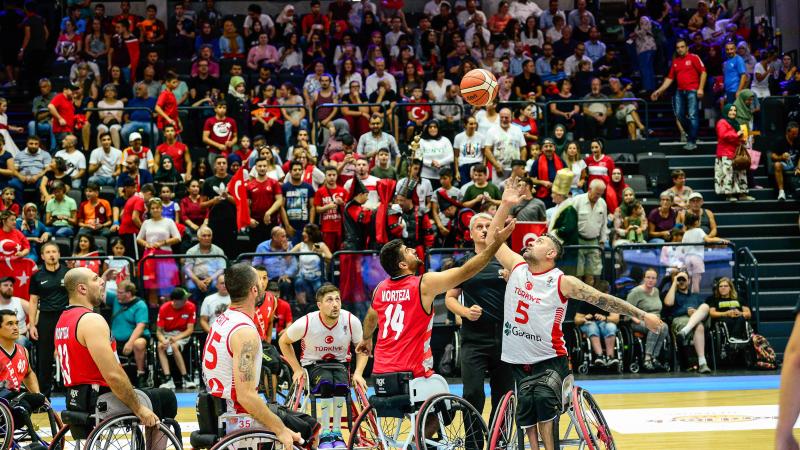 Male wheelchair basketballers Morteza Ebrahimi and Ozgur Gurbulak fight for the ball