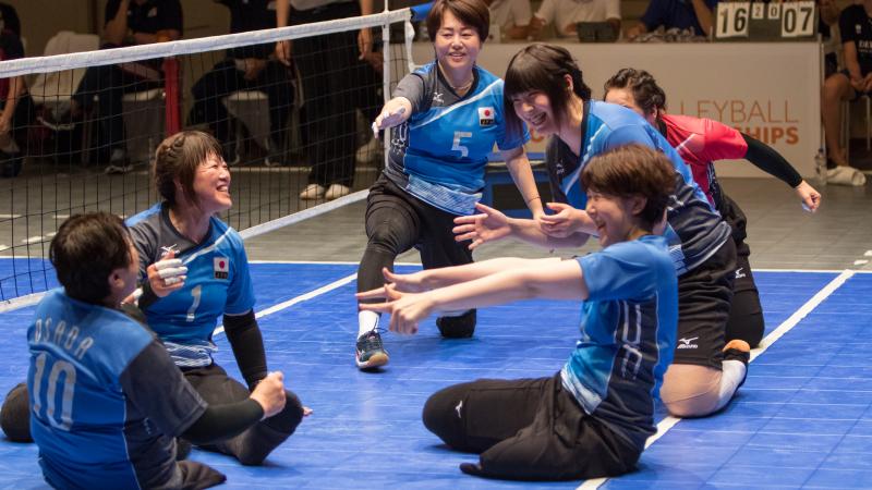 female Japanese sitting volleyball players play the ball