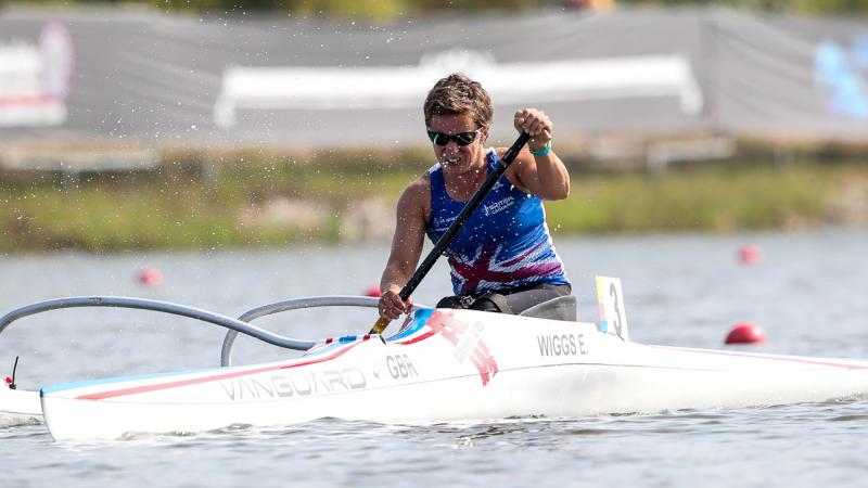 female Para canoeist Emma Wiggs performing a stroke