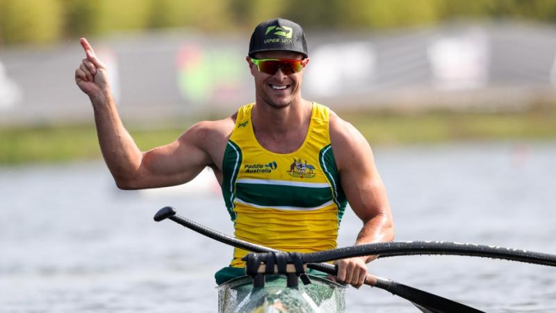 Man in a canoe celebrating