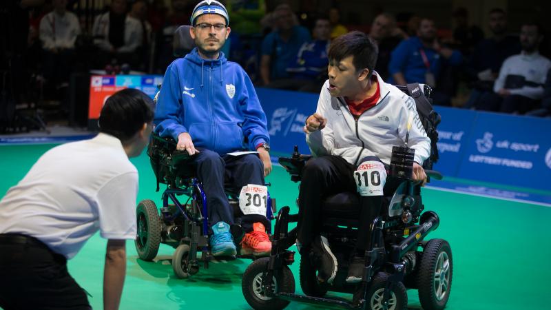 male boccia players Greg Polychronidis and Howon Jeong prepare to play