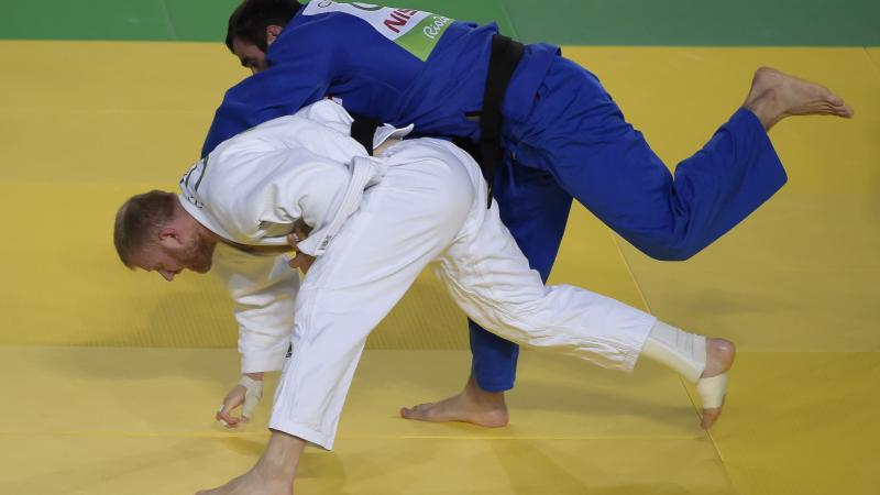 Georgia's Zviad Gogotchuri battles with Ukraine's Oleksandr Nazarenko during the men's -90kg judo gold medal match at the Rio 2016 Paralympic Games.