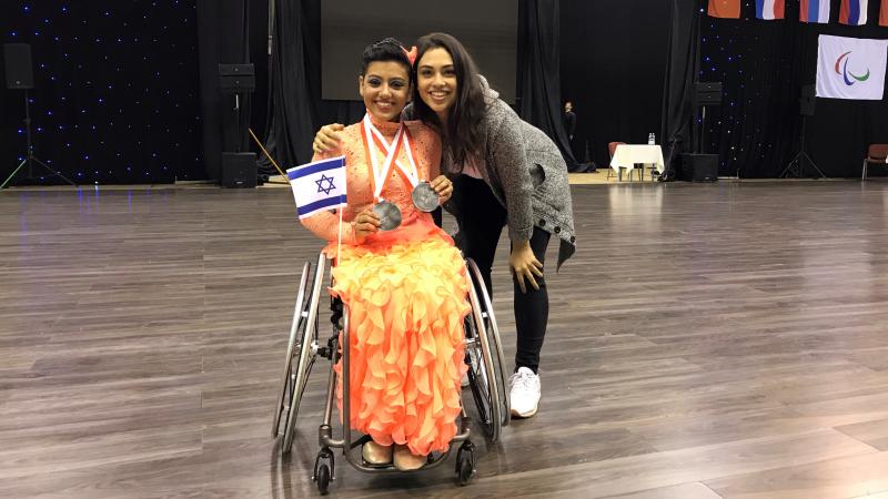 female Para dancer Tomer Margalit hugging her twin 