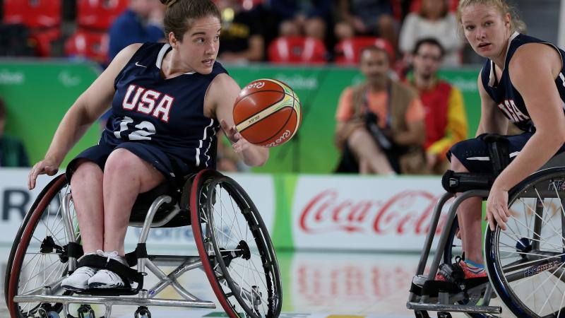 female wheelchair basketballer Rebecca Murray dribbles the ball on court