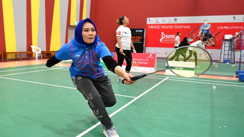 Female Para badminton player practices during workshop in UAE