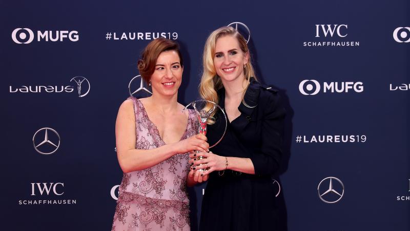 female Para alpine skier Henrieta Farkasova and guide Natalia Subrtova holding a silver Laureus trophy