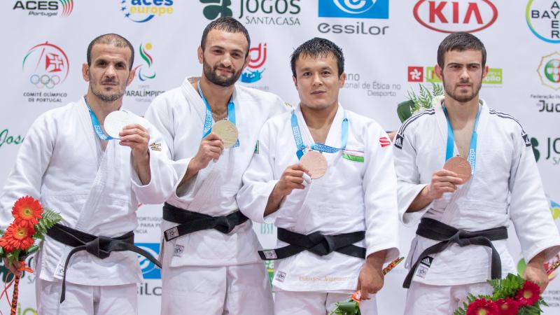 four male judokas on the podium with their medals, with Giorgi Gamjashvili on the end holding bronze