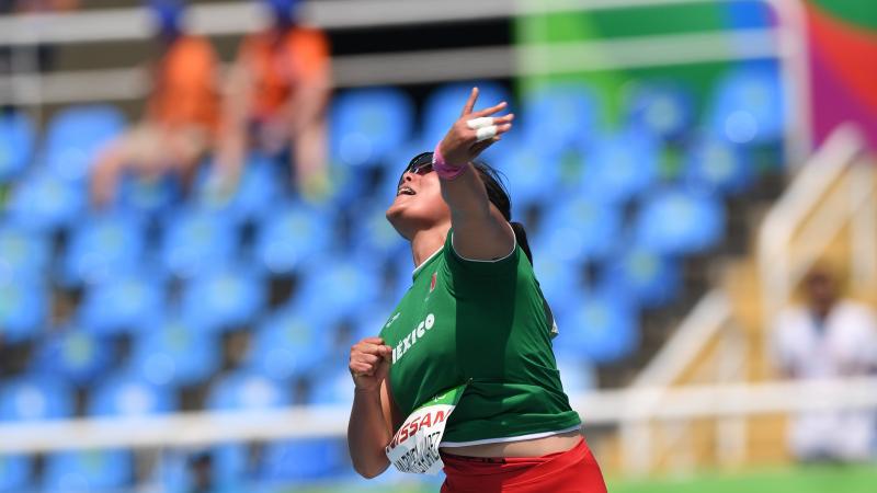 female Para athlete Rebeca Valenzuela Alvarez throws the shot put