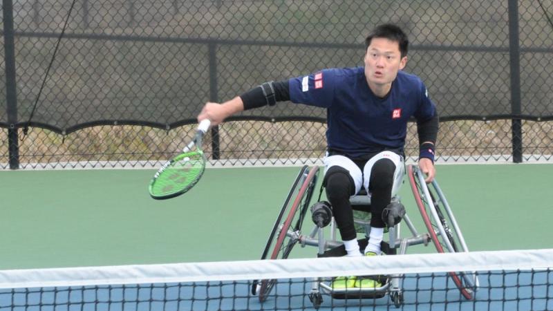 male wheelchair tennis player Shingo Kunieda prepares to play a backhand on a hard court