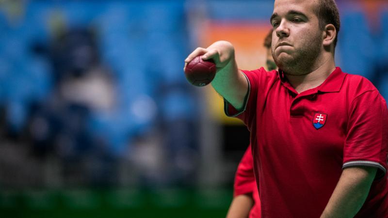 male boccia player Samuel Andrejcik throws a ball