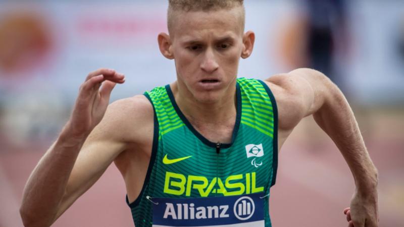 A man running on an athletics track