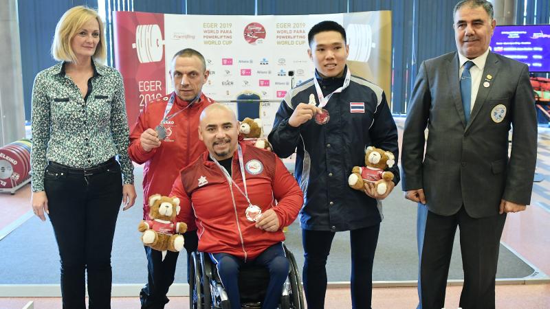 Juan Carlos Garrido holds his gold medal