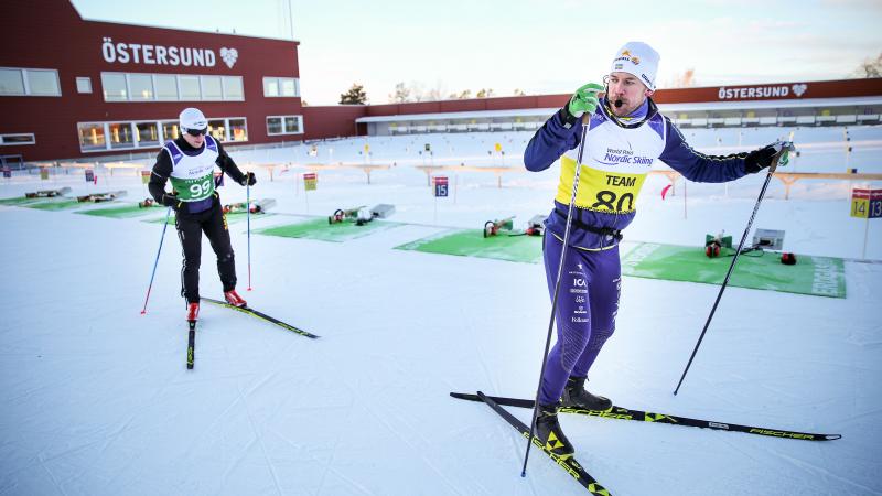 A blind Nordic skier following his guide