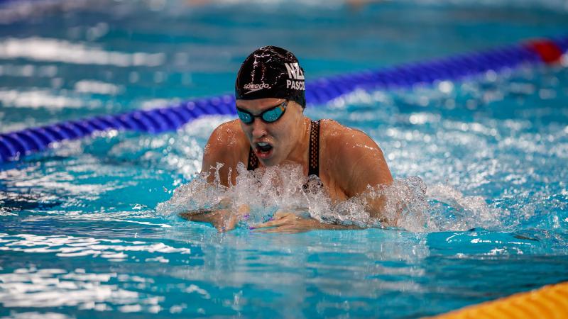 A woman swimming breaststroke 