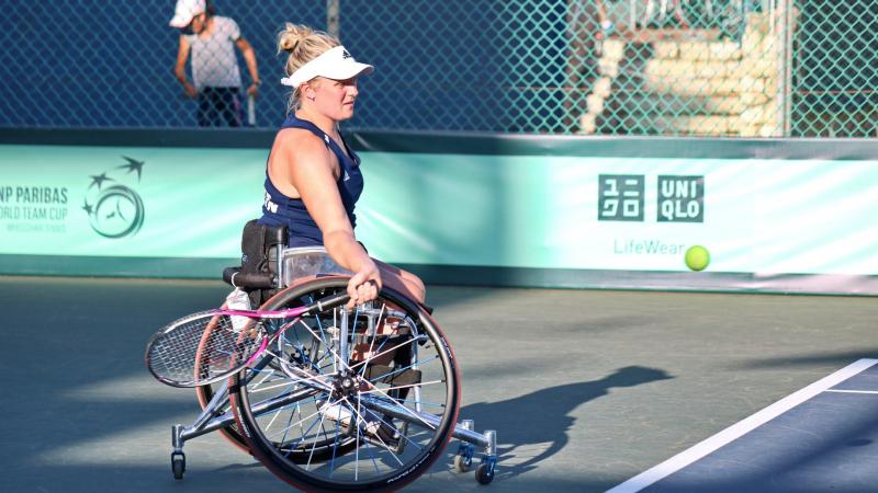 Wheelchair tennis player Jordanne Whiley about to hit the ball