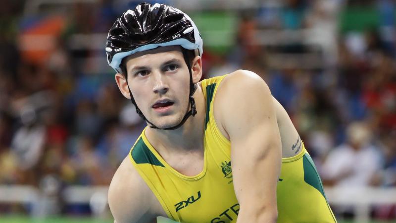 Rheed McCracken looks to the front after a race while wearing his Australian gear and helmet after the race