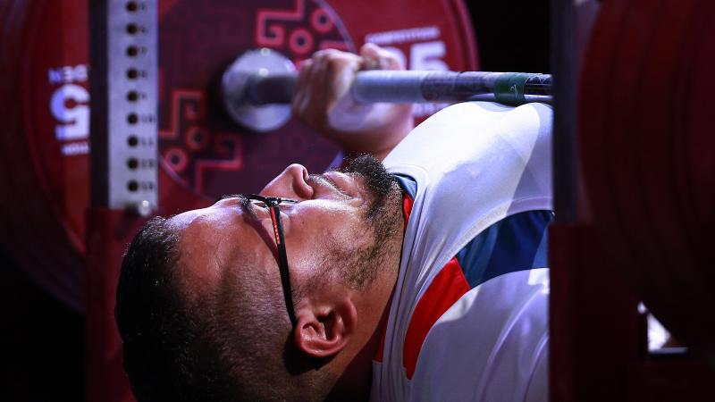 French powerlifter Rafik Arabat lifts the bar