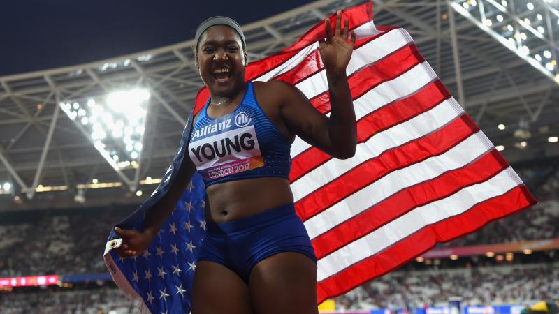 Deja Young - USA - Athletics Deja Young laughs while waiving the US flag