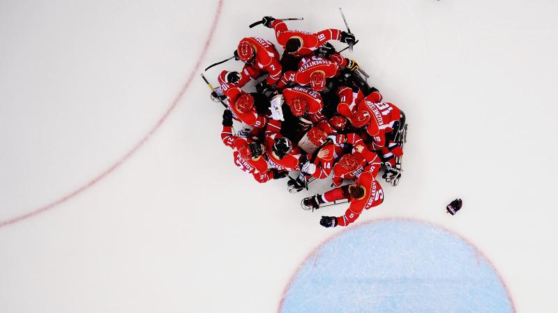 Russia's Para ice hockey players celebrating on ice