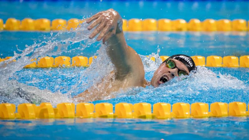 A man swimming in a pool