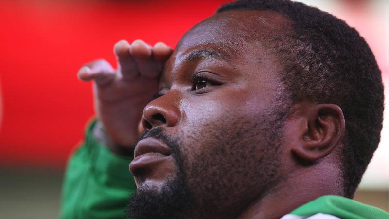 Nigerian powerlifter Paul Kehinde salutes the flag