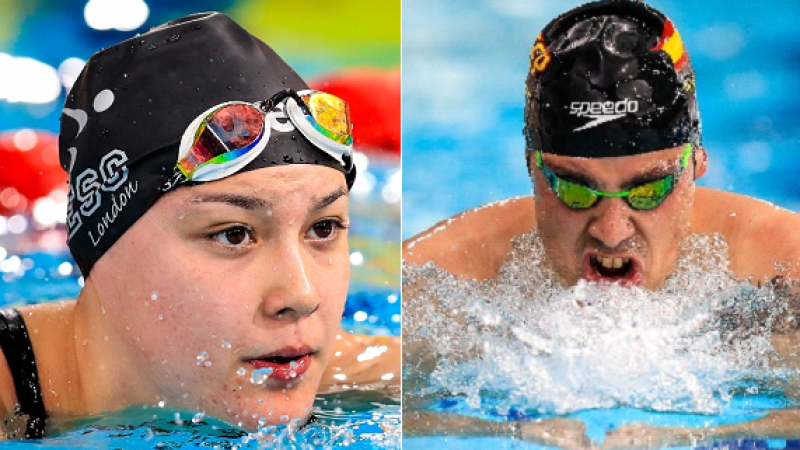 A female and a male swimmer in the water