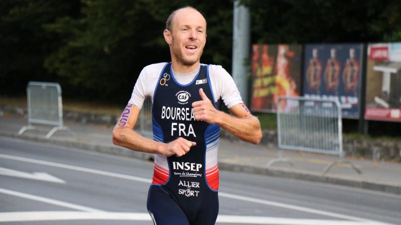 Yannick Bourseaux exhausted running to the finish line