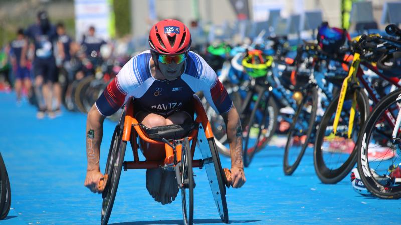 A male Para triathlete in a wheelchair race