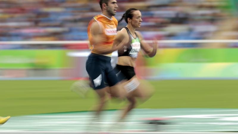 Elena Chebanu - Azerbaijan - Para Athletics - Rio 2016 A female sprinter next to her guide on an athletics track