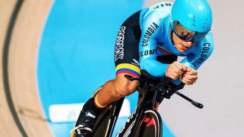 Colombian man riding his bike in a velodrome 