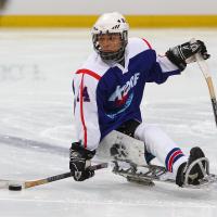 A picture of the ice sledge hockey player on the field