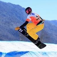 A picture of a woman doing snowboarding.